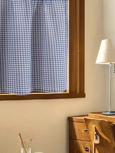 Blue and white checkered short curtain for windows in a cozy rustic interior style