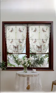 Detailed close-up of white semi-sheer roman curtain with butterfly and floral embroidery