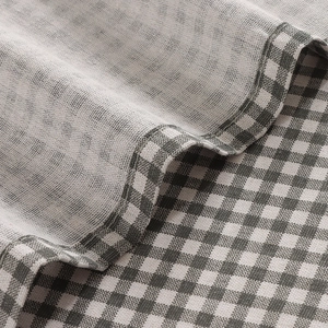 Minimalist grey gingham fabric curtain with high-quality stitching and soft texture