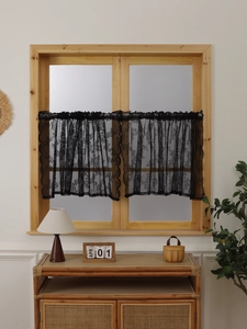 Close-up of black floral lace cafe curtain with delicate crochet detail for windows