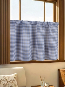 Blue and white checkered cafe curtain made of cotton linen fabric hanging on a wooden window