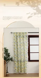 Detailed view of yellow lemon print curtain with ruffled edges and sheer texture