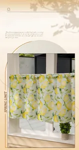 Detail of rod pocket cafe curtain with yellow lemon pattern on light green fabric