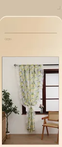 Detail of yellow lemon print semi-sheer curtain with elegant white ruffled edges
