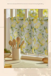 Detail of semi-sheer kitchen cafe curtain featuring yellow lemon and green leaf patterns