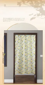 Detailed close-up of lemon print door curtain made of fabric hanging in a wooden frame