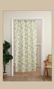 Detail of Nordic door curtain featuring yellow lemon pattern and telescopic rod in home interior