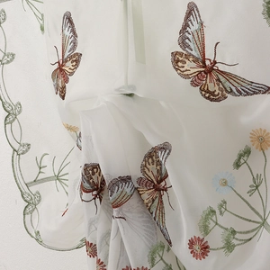 White sheer curtain with colorful butterfly embroidery and floral patterns for living room