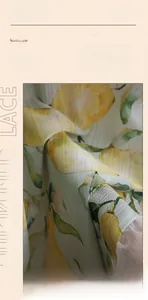 Detailed close-up of thickened lace fabric featuring fresh yellow lemon prints and leaves