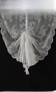 Detailed view of white floral lace curtain with scalloped edges and adjustable satin ribbon