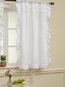 Close-up of white sheer curtain with ruffle edges and rod pocket in home setting