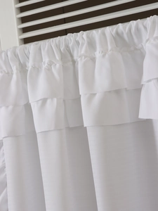 Close-up of white layered ruffle sheer curtain with soft pleats and elegant draping