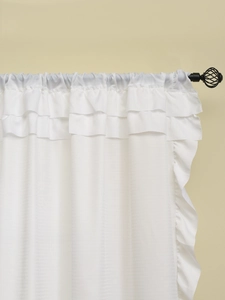 Close-up of white ruffle curtains with subtle horizontal textures and romantic style