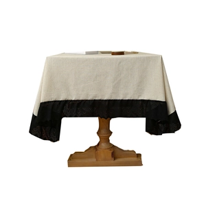Waterproof rectangular linen tablecloth with black lace edge on a wooden table