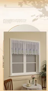 Detail of white lace cafe curtain featuring purple lavender embroidery and rod pocket