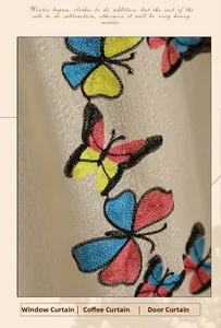 Close-up of colorful butterfly embroidery on cream-colored fabric for curtains