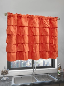 Detail view of orange ruffled cafe curtains with multi-layer design for small windows
