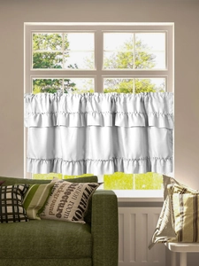 Detail of white ruffled cafe curtain with three-layer pleated design and rod pocket top