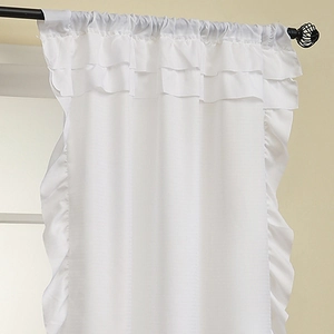 White semi-sheer curtain with ruffled edges on a rod for living room privacy