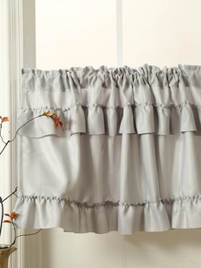 Detail of silver gray ruffled coffee curtain valance with triple layered wave design