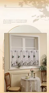 Detail of lace coffee curtain with coffee cup prints and elegant wave embroidery