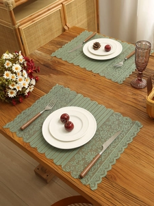 Close-up of retro hollow lace table runner with fringe and floral knit texture