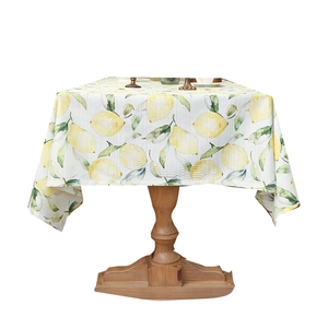 Waterproof cream floral tablecloth with lemon pattern on wooden table for picnic or cafe