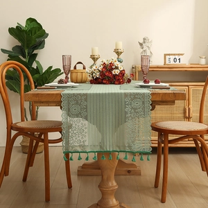 Vintage sage green lace table runner with fringe tassels and crochet hollow-out design