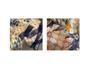 Detailed macro view of floral print scarf showing refined double-stitched hem and sheer fabric
