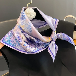 Elegant purple floral mulberry silk square scarf styled on a black garment for women