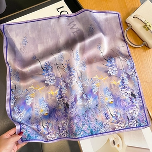 Elegant purple silk square scarf with wisteria floral print on a luxury background