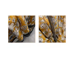 Detail of soft yellow floral chiffon scarf showing premium digital print and neat edge stitching