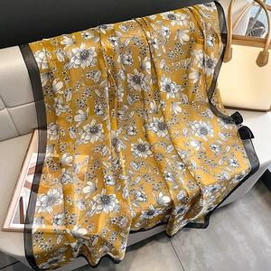 Elegant yellow floral chiffon scarf displayed as a summer sunscreen shawl and wrap