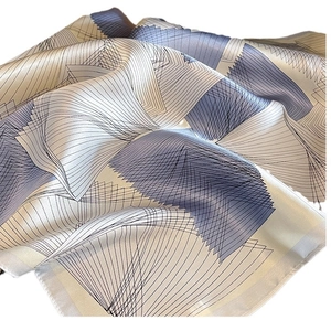 Elegant silk square scarf with light blue and beige geometric patterns for women