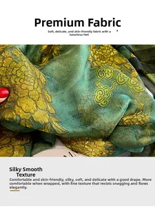 Detail of soft silk-feel scarf featuring green and gold vintage chrysanthemum floral prints