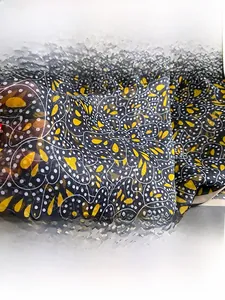 Detailed macro view of soft floral chiffon fabric with delicate wing pattern and smooth texture