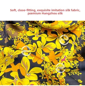 Detail of soft silk-like fabric with vibrant floral print and breathable smooth texture