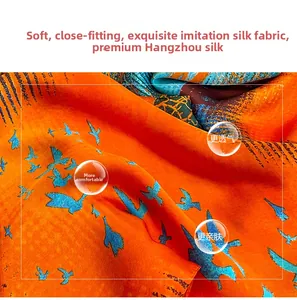 Detail showing high-quality imitation silk fabric with vibrant orange and blue bird prints
