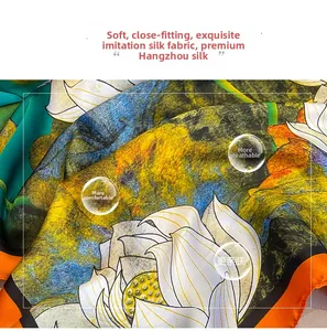 Close-up of silk-like fabric featuring an artistic lotus print with a smooth texture