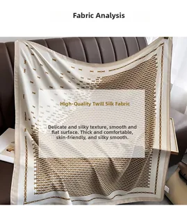Detail of twill silk scarf with brown geometric pattern on dark leather background