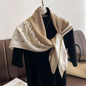 Fashionable twill monogram silk square scarf in cream and gold for versatile styling