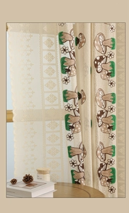 Close-up of beige lace curtain with detailed mushroom and floral embroidery patterns