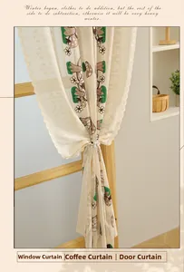 Close-up of embroidered mushroom pattern on off-white lace curtain with pearl tieback