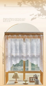 Close-up of white daisy lace cafe curtain with delicate floral embroidery and wavy hem