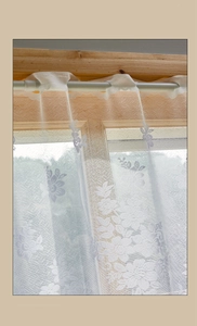 Detailed close-up of white daisy lace curtain with floral embroidery for kitchen windows