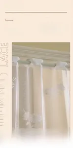 Close-up of white daisy floral lace pattern and high-quality thickened cafe curtain fabric