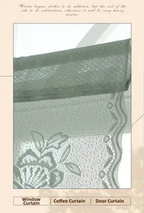 Close-up of light green lace curtain with floral embroidery and wavy scalloped edges