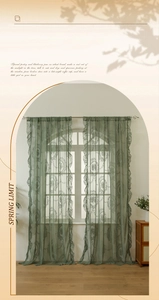 Detailed view of dark green French lace curtain with delicate floral embroidery and ruffles