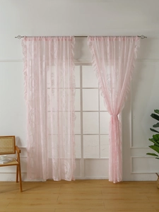 Detailed view of French lace curtains featuring pink floral jacquard and ruffled edges