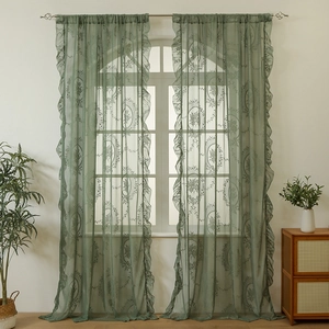 Dark green French lace curtain with vintage floral patterns and ruffled edges